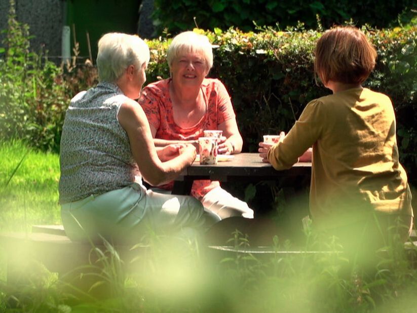 Residents relax on picnic bench in one of Nepgill's green spaces.